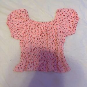 pink cherry crop top, loosely fitted.